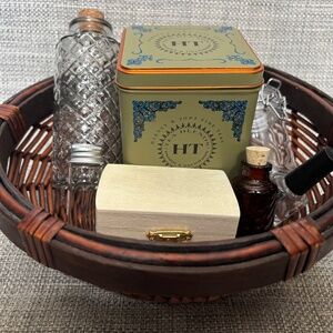 opening and closing containers in dark wicker basket by idlewild montessori